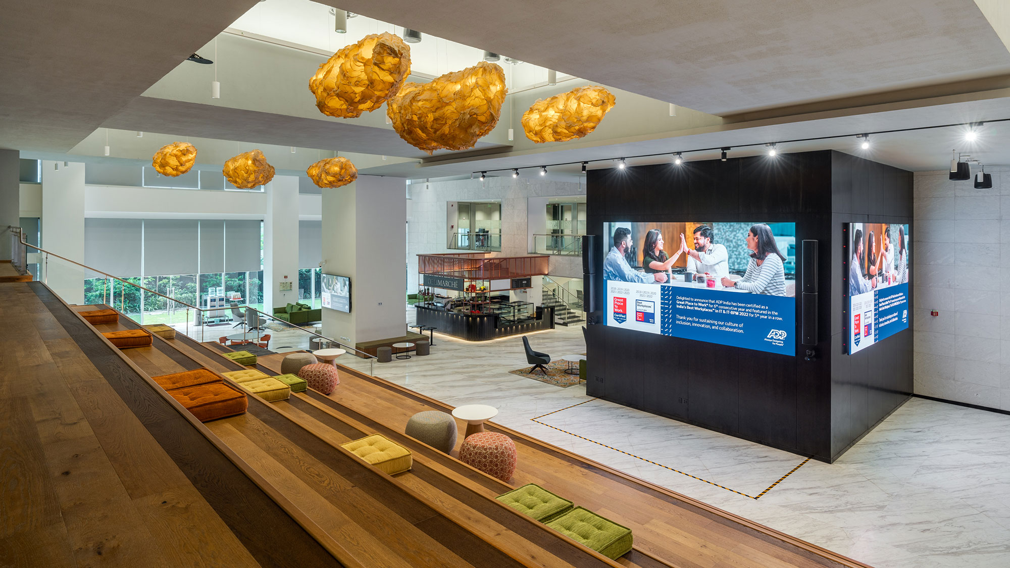 A room with a large screen and chairs.